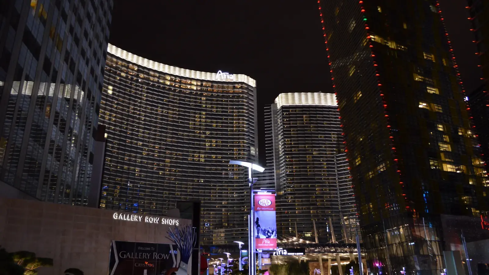 ARIA's curved hotel towers at night on the ARIA campus in Las Vegas