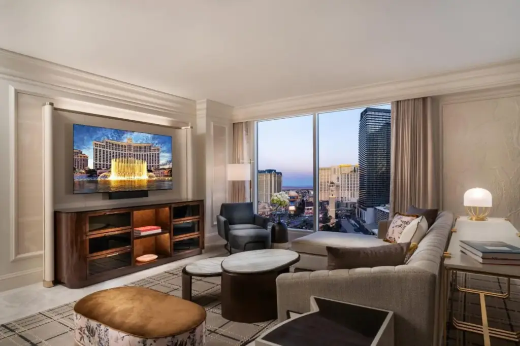 a living room with a couch and a large window at Bellagio in Las Vegas