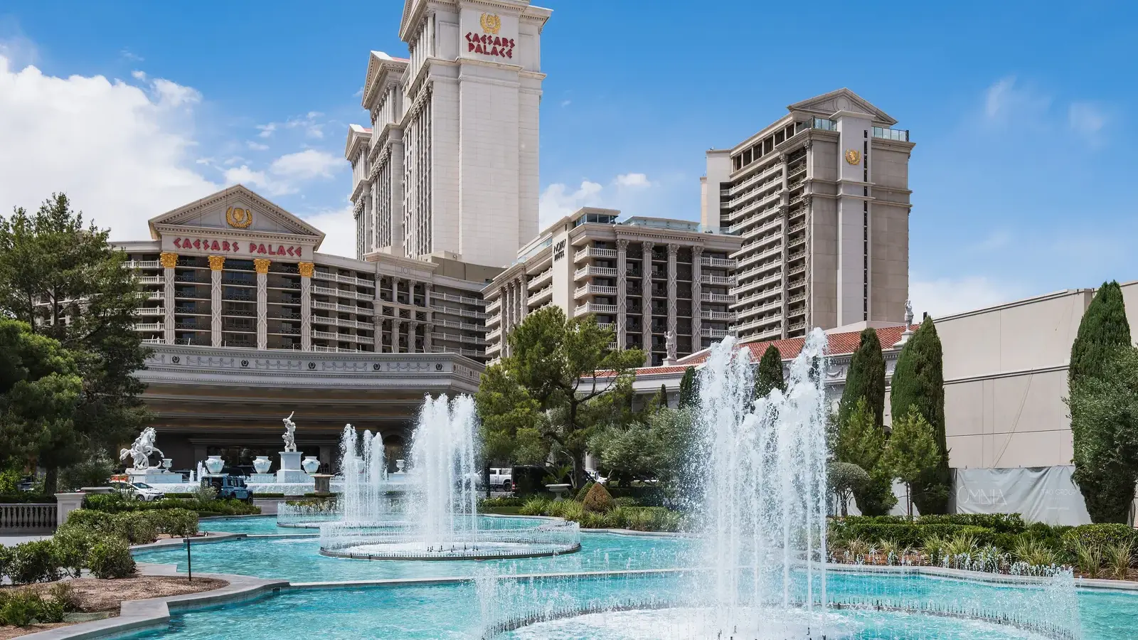 Caesars Palace towers behind its fountains and gardens on the Strip
