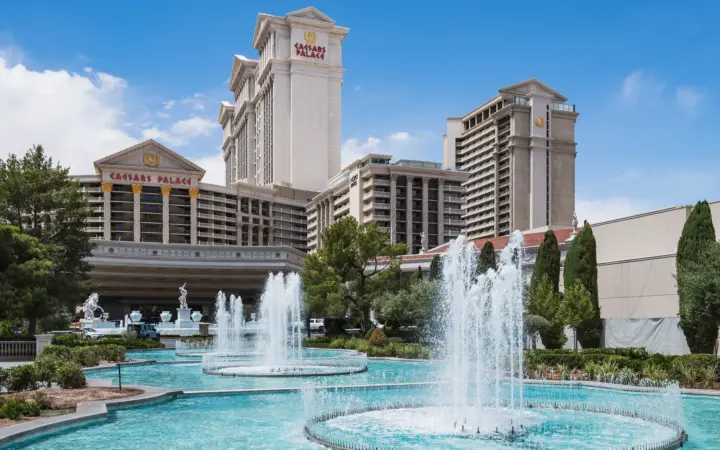 Caesars Palace towers behind its fountains and gardens on the Strip