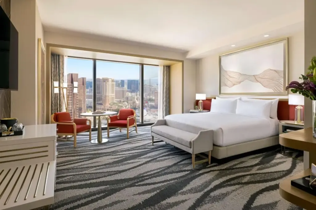 a hotel room with a bed and a large window at Conrad Las Vegas At Resorts World in Las Vegas