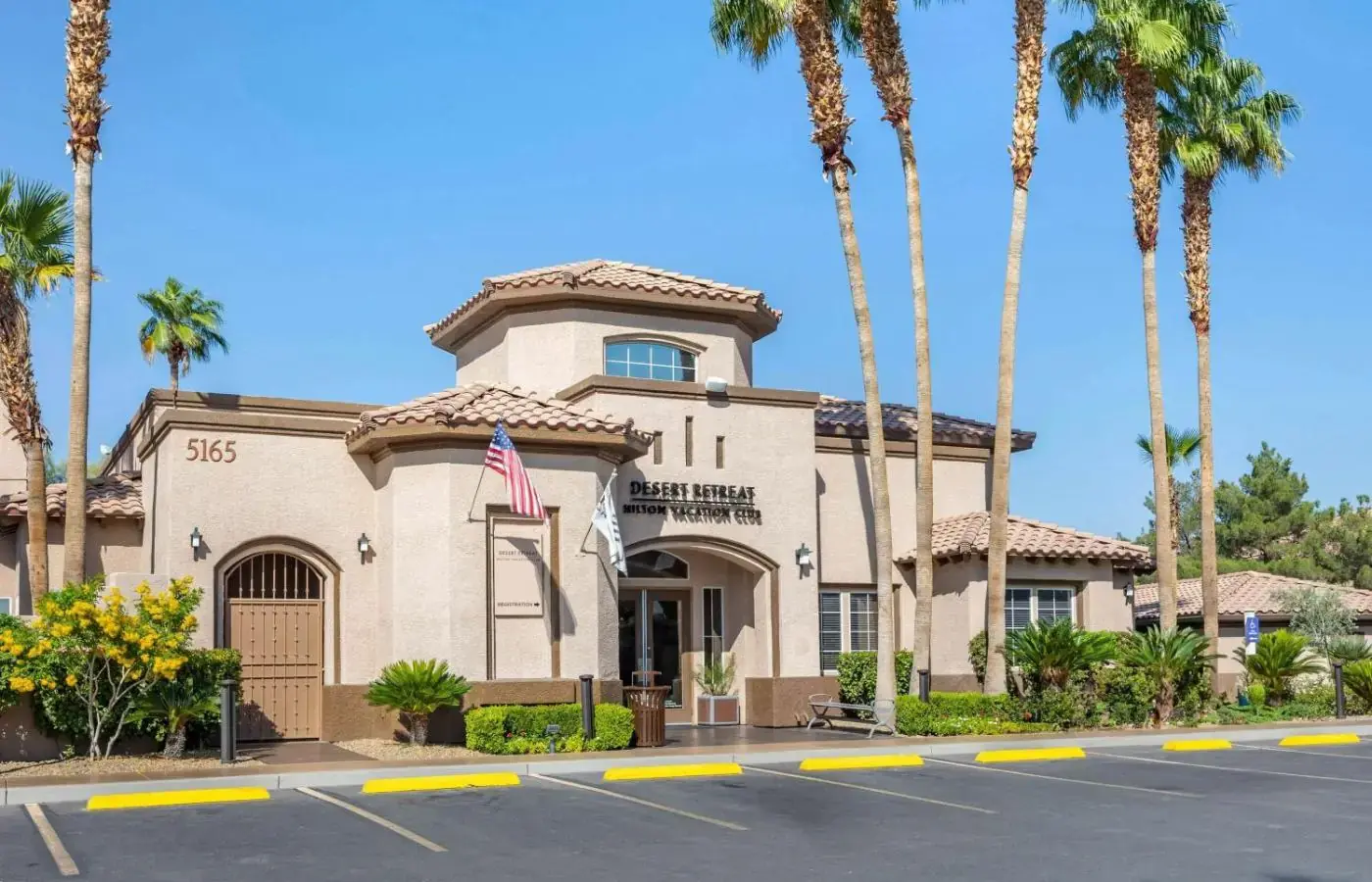 Desert Retreat entrance with legacy Desert Paradise branding in the property gallery