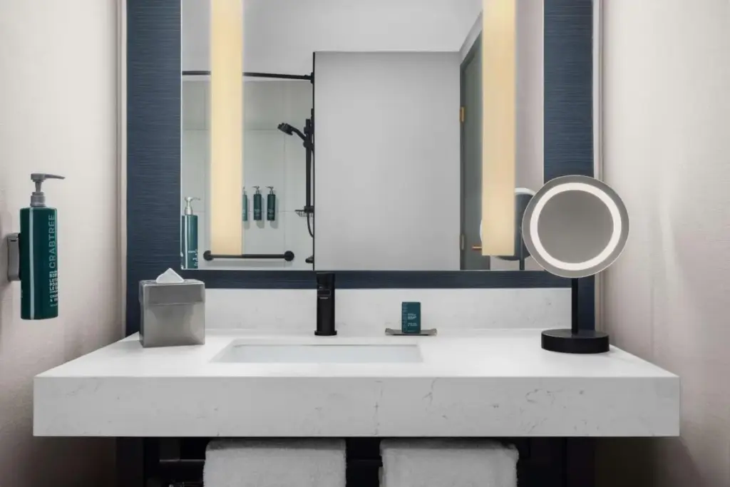a bathroom with a white sink and a mirror at DoubleTree by Hilton Las Vegas Airport in Las Vegas