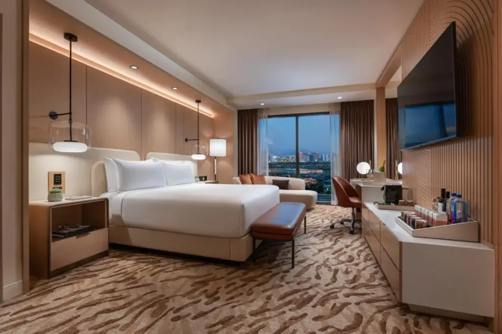 a hotel room with a bed and a desk at Durango Casino & Resort in Las Vegas