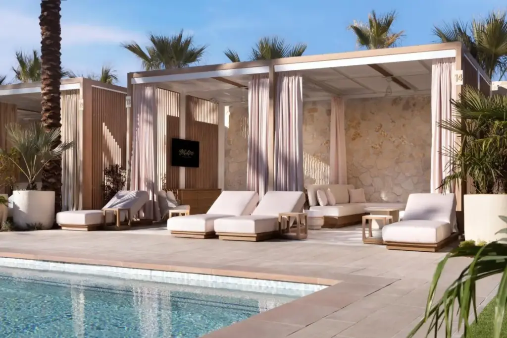 a resort with a pool and lounge chairs and a tv at Durango Casino & Resort in Las Vegas
