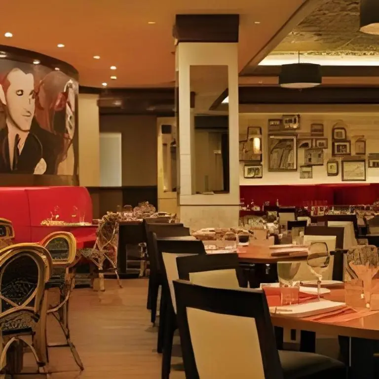 a restaurant with tables and chairs and a painting of a man at El Cortez Hotel & Casino - 21 and over only in Las Vegas
