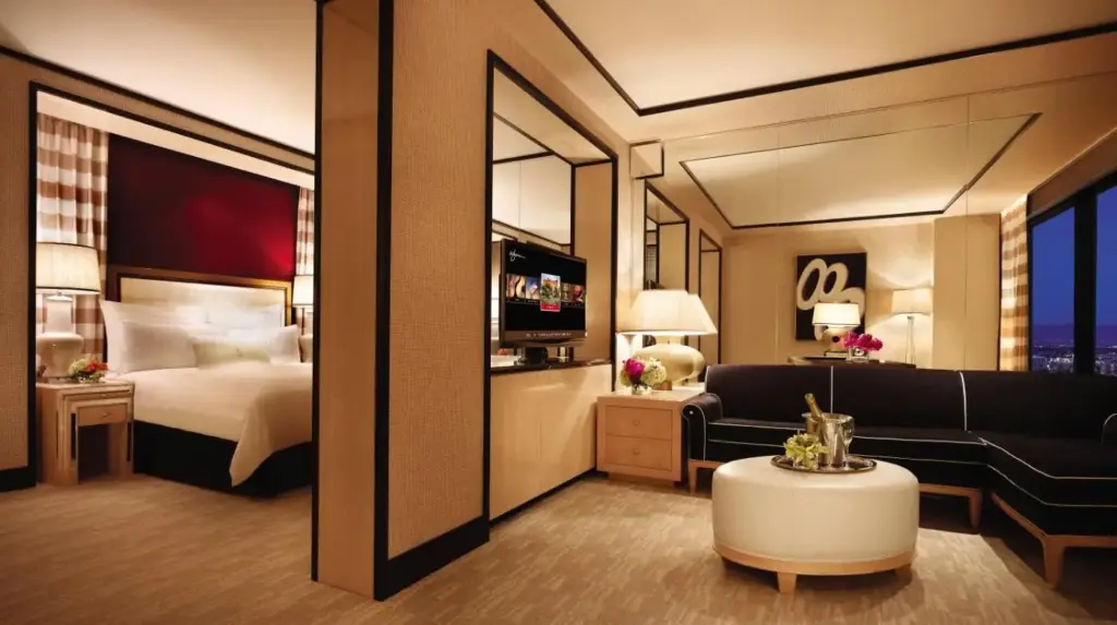 a hotel room with a bed and a couch at Encore at Wynn Las Vegas in Las Vegas