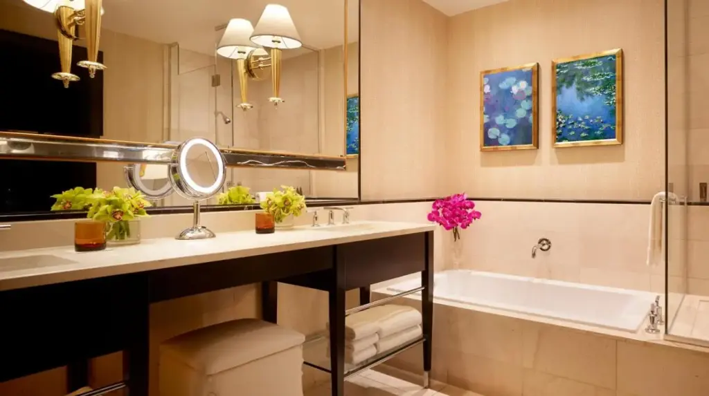 a bathroom with a bath tub and a sink and a bath tub at Encore at Wynn Las Vegas in Las Vegas