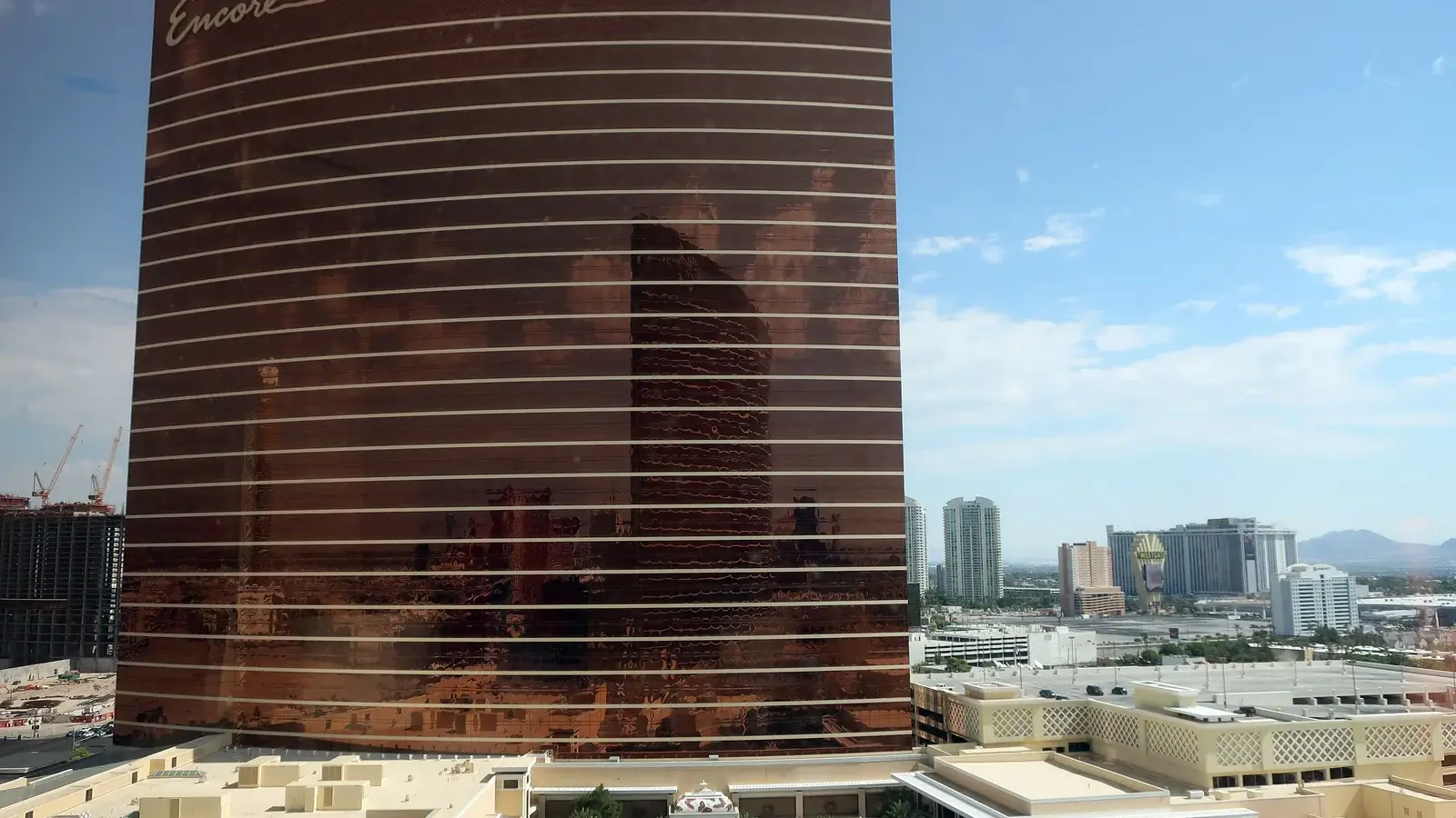 Encore Las Vegas hotel tower under a blue sky