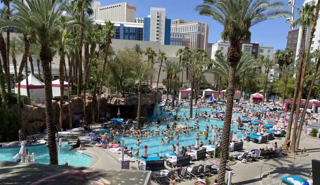 Crowded pool at the Flamingo Las Vegas on a hot summer day, seen from above