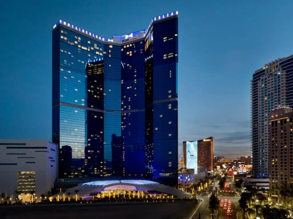 a large building in a city at night at Fontainebleau Las Vegas, MICHELIN Key Award Hotel in Las Vegas