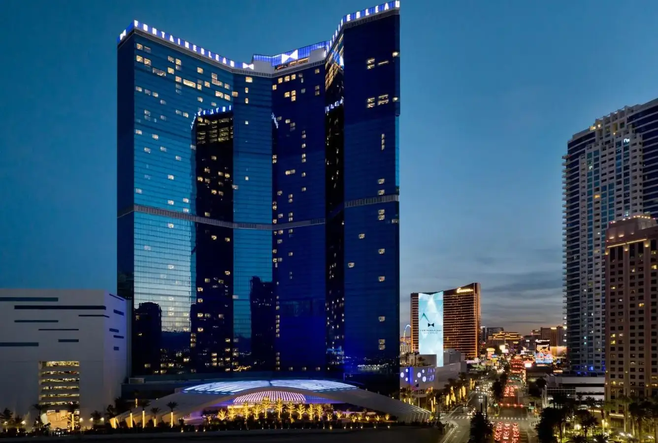 a large building in a city at night at Fontainebleau Las Vegas, MICHELIN Key Award Hotel in Las Vegas