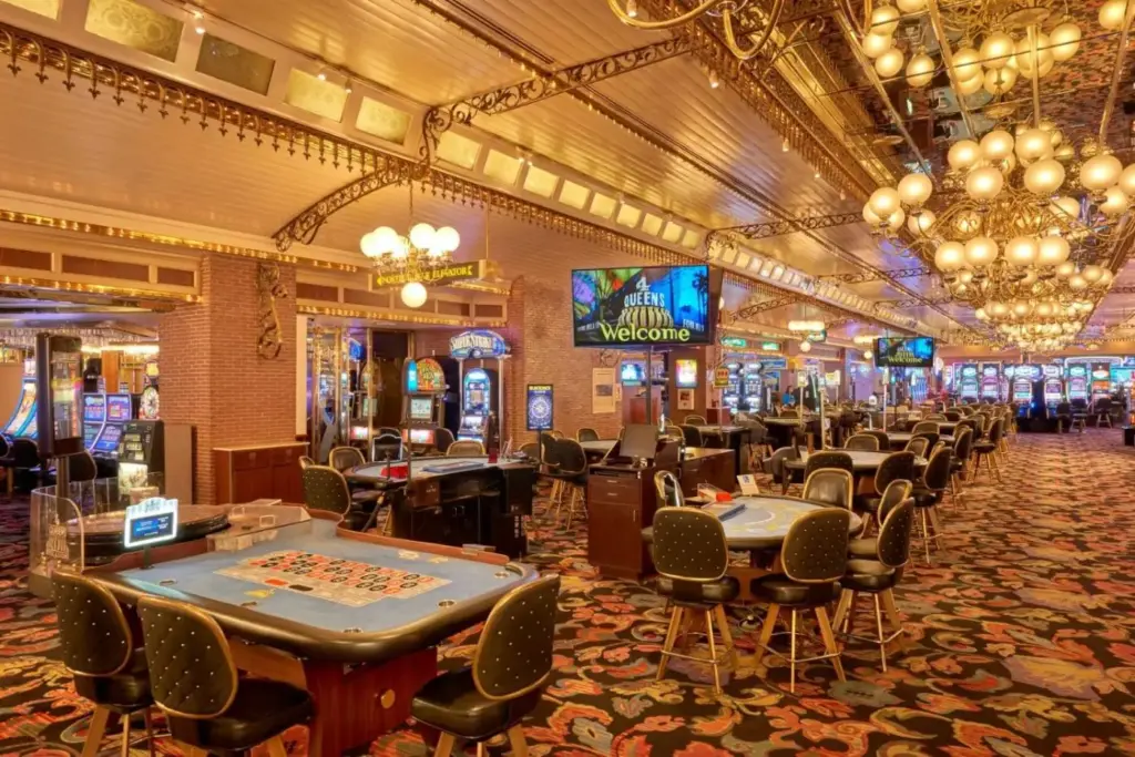 a large room with tables and chairs in a casino at Four Queens Hotel and Casino in Las Vegas