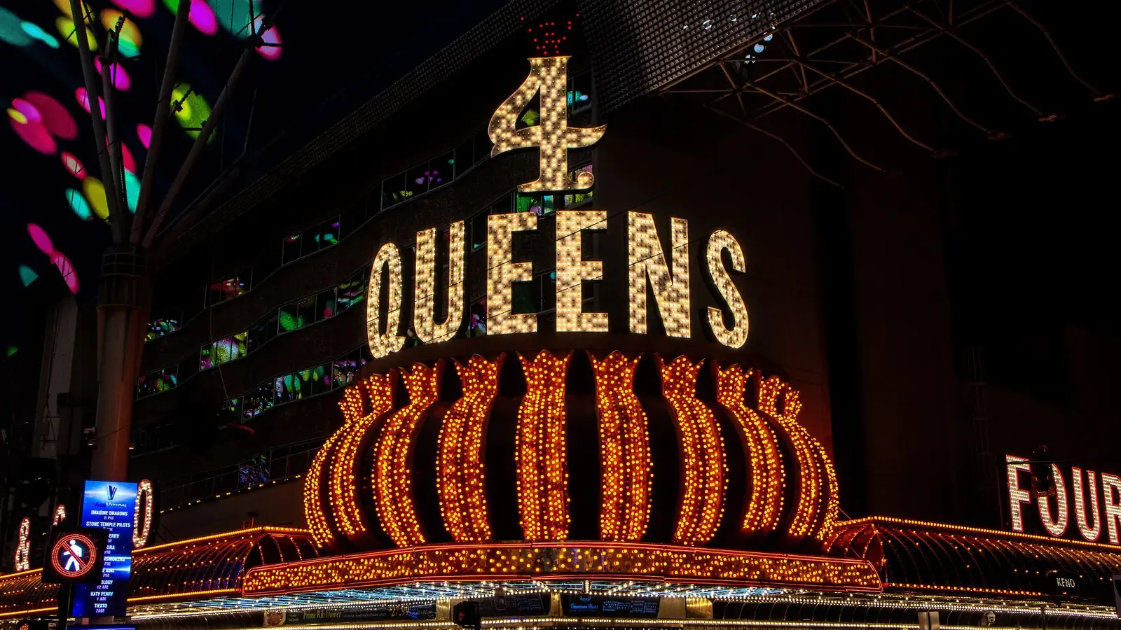 The 4 Queens neon sign glowing on Fremont Street