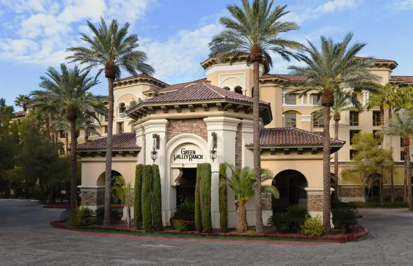 a building with palm trees in front of it at Green Valley Ranch Resort Spa Casino in Las Vegas