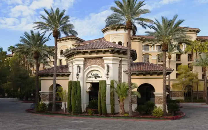 a building with palm trees in front of it at Green Valley Ranch Resort Spa Casino in Las Vegas