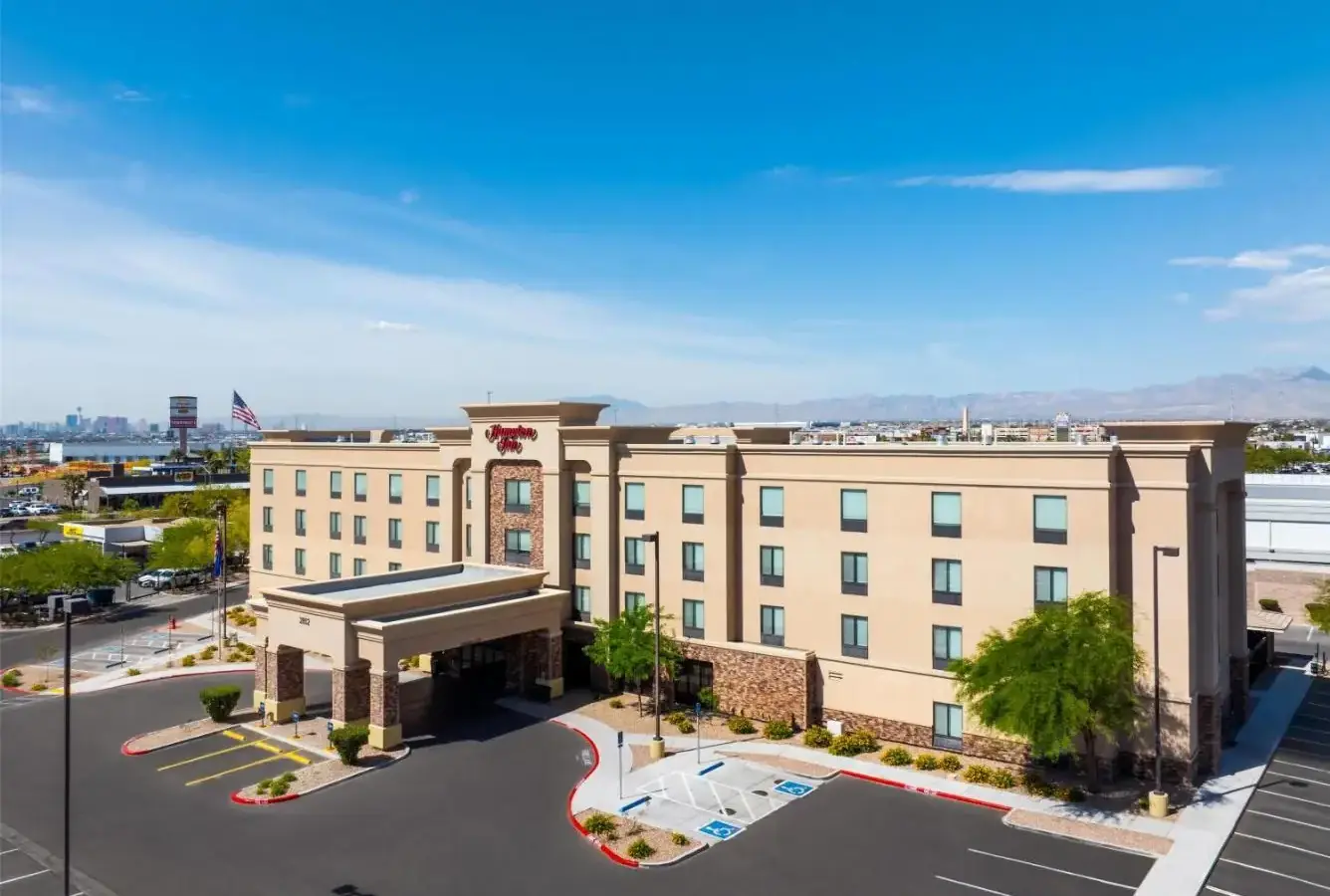 an aerial view of a hotel with a parking lot at Hampton Inn Las Vegas/North Speedway in Las Vegas