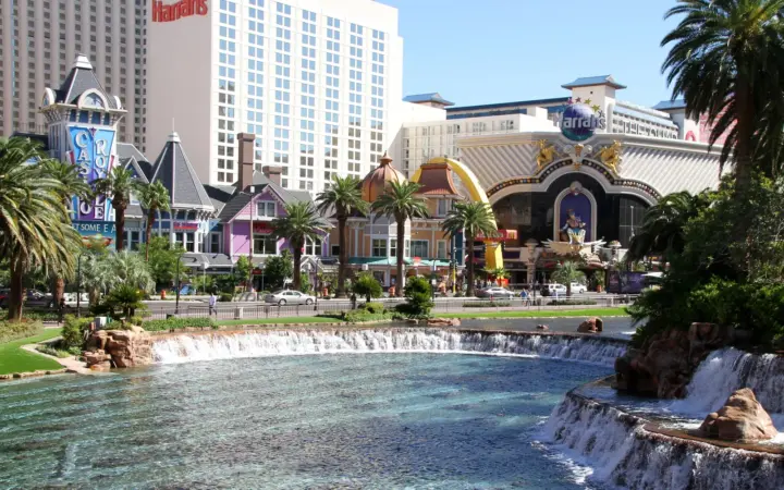 Harrah's Las Vegas hotel and carnival-style facade across from the Mirage waterfalls