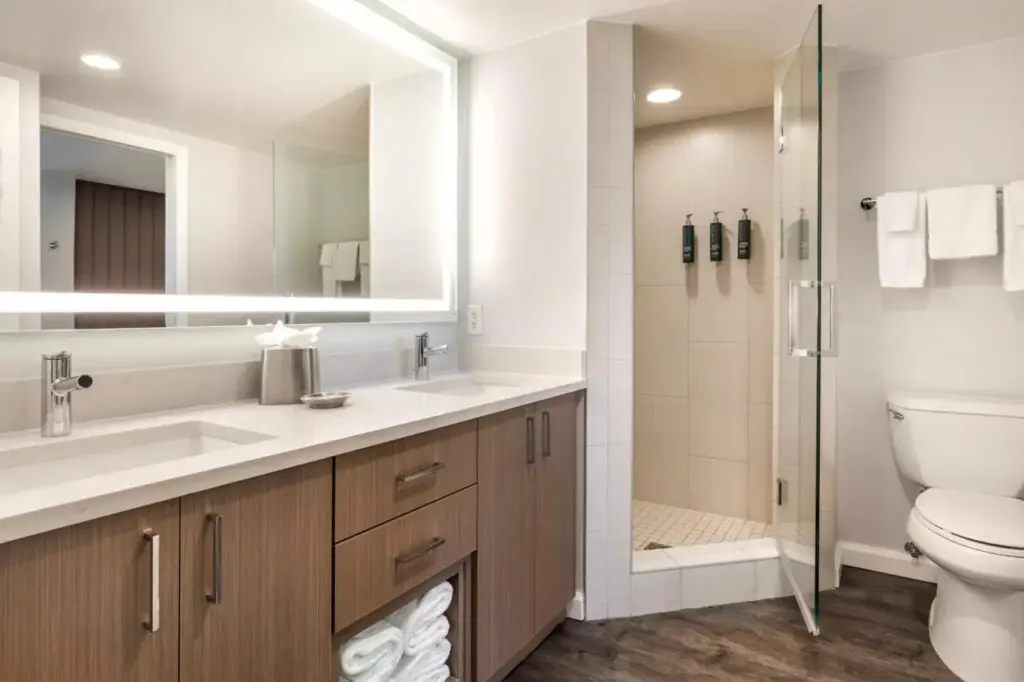a bathroom with a toilet sink and a shower at Hilton Grand Vacations Club Paradise Las Vegas in Las Vegas