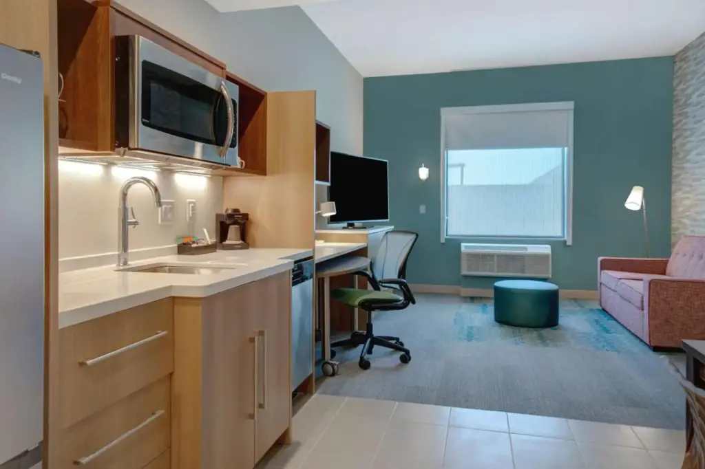 Kitchen and work area in a Home2 Suites Las Vegas North suite