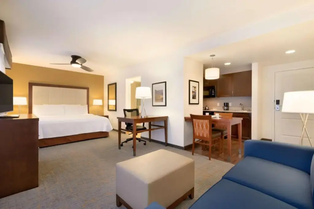 a hotel room with a bed and a living room at Homewood Suites by Hilton Las Vegas Airport in Las Vegas