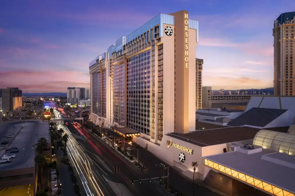 a tall building with a clock on it on a city street at Horseshoe Las Vegas Hotel & Casino - A Caesars Rewards Destination in Las Vegas