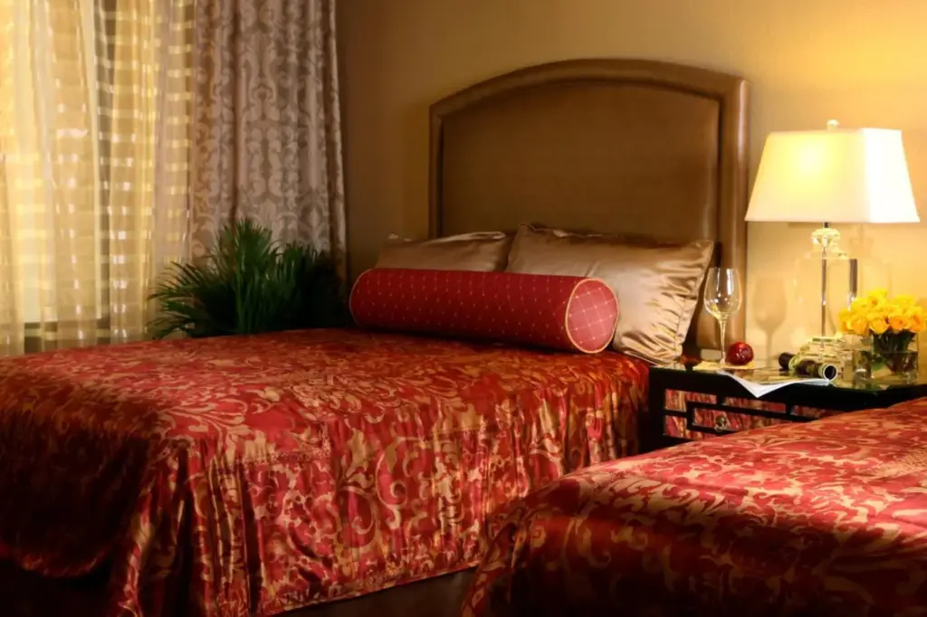 Example Jockey Club bedroom with a bed and upholstered headboard