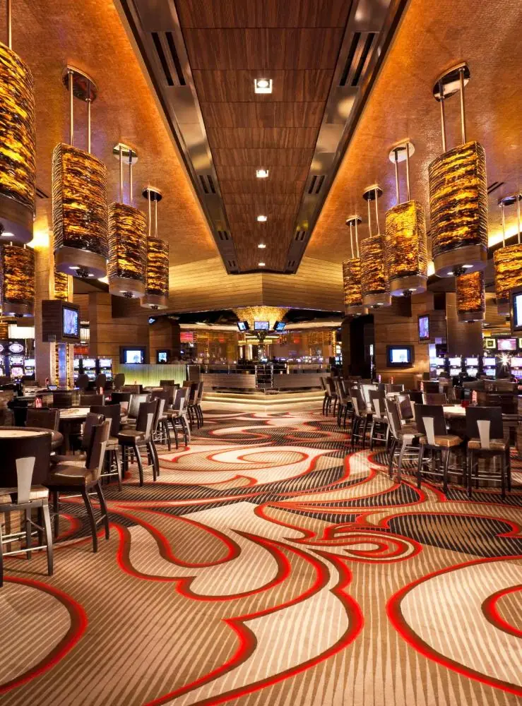 a restaurant with tables and chairs on a carpet at M Resort Spa & Casino in Las Vegas