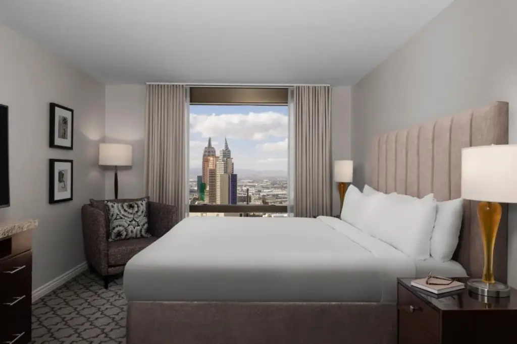 a hotel room with a large bed and a window at Marriott's Grand Chateau in Las Vegas