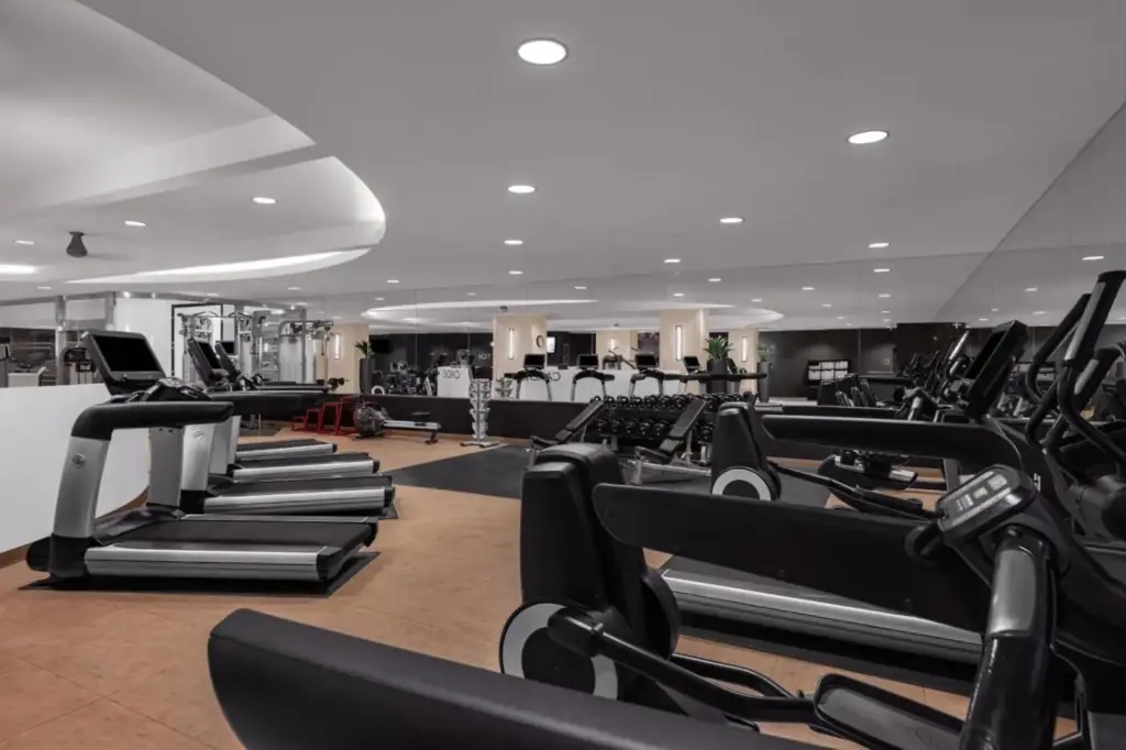 a gym with rows of treadmills and elliptical machines at Marriott's Grand Chateau in Las Vegas