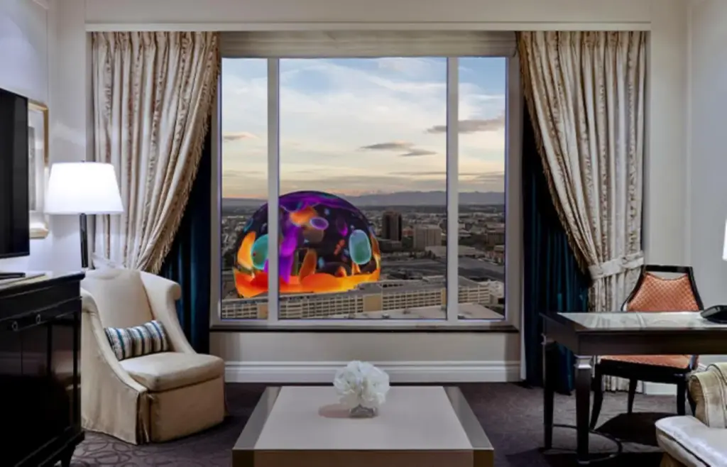 a living room with a large window with a view at The Palazzo at The Venetian® in Las Vegas