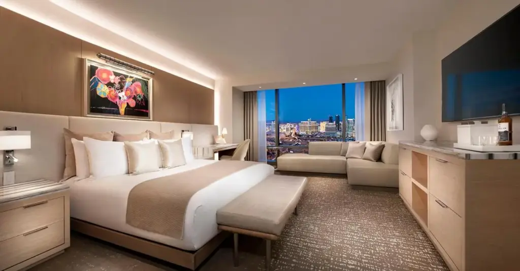 a bedroom with a large bed and a living room at Palms Casino Resort in Las Vegas