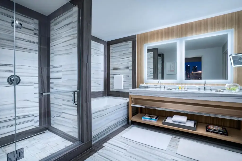 a bathroom with a shower and a tub and a sink at Palms Casino Resort in Las Vegas
