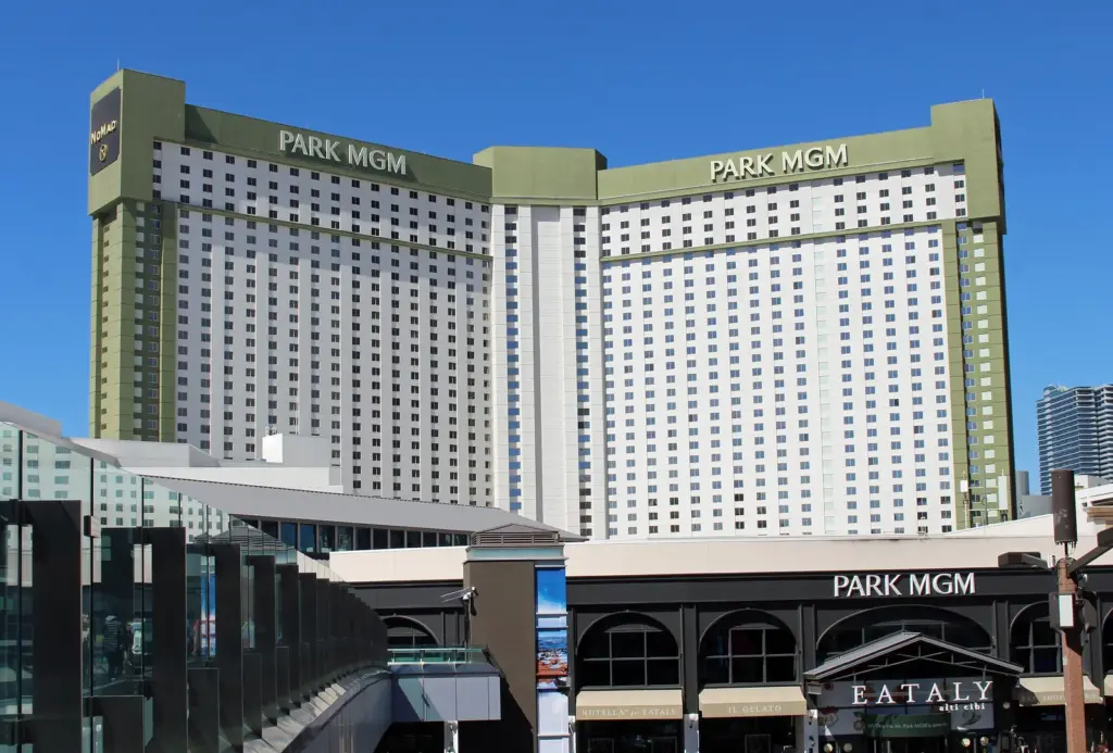 Park MGM hotel tower and Eataly entrance seen from a Strip pedestrian bridge