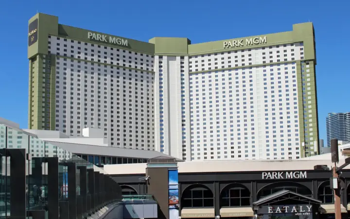 Park MGM hotel tower and Eataly entrance seen from a Strip pedestrian bridge