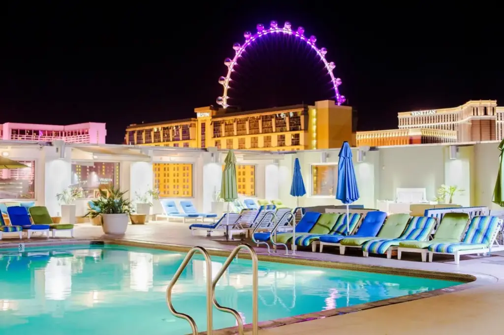 The Platinum Hotel outdoor pool with the High Roller beyond nearby buildings