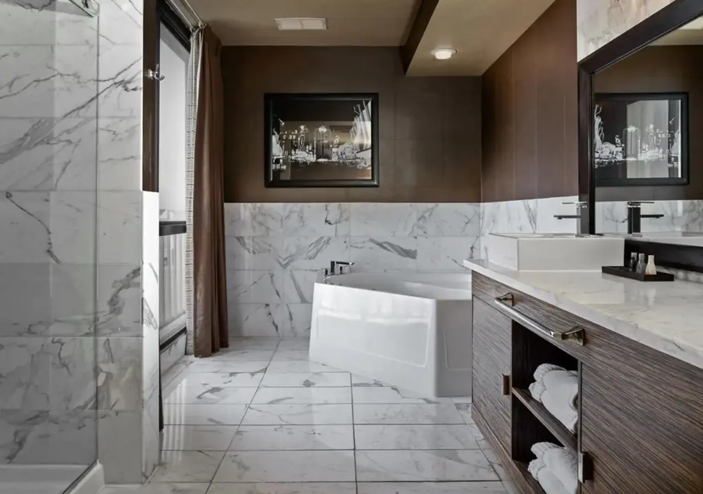 a bathroom with a tub and a sink at Plaza Hotel & Casino in Las Vegas