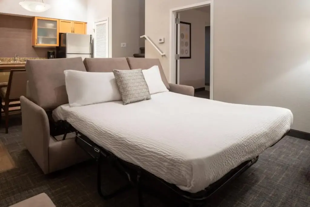 a bed in a room next to a couch at Residence Inn by Marriott Las Vegas Convention Center in Las Vegas