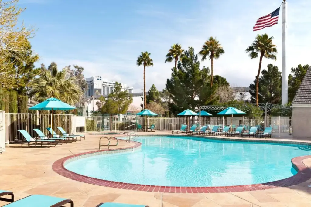 a swimming pool with chairs and an american flag at Residence Inn by Marriott Las Vegas Convention Center in Las Vegas