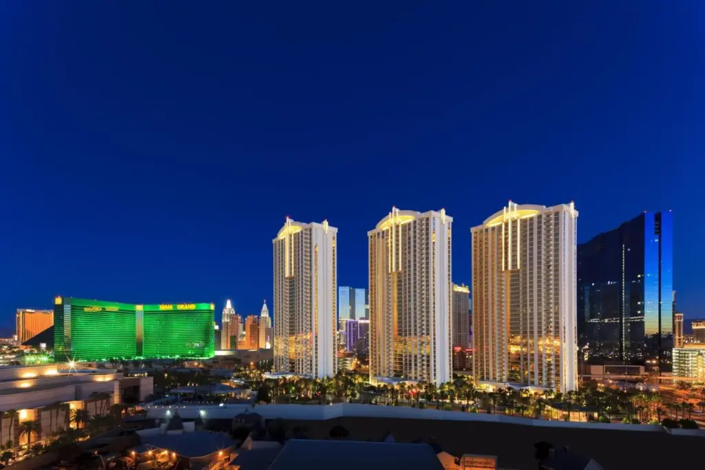 The Signature at MGM Grand towers beside MGM Grand at night
