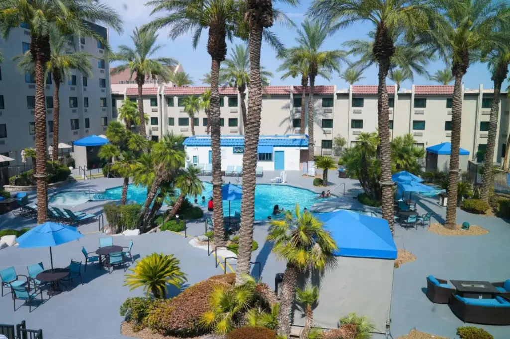 an aerial view of a resort with a pool and palm trees at Silver Sevens Hotel and Casino, a Wyndham Garden in Las Vegas