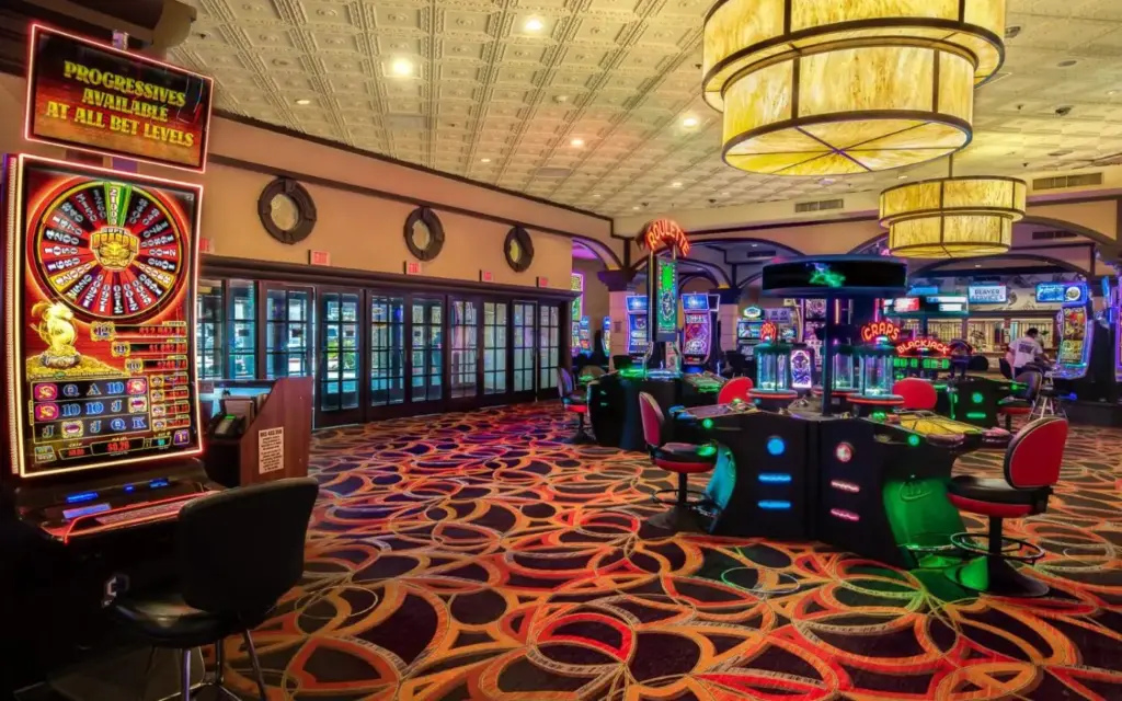 a casino with lots of slot machines and a gaming room at Silver Sevens Hotel and Casino, a Wyndham Garden in Las Vegas