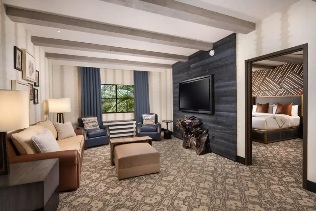 a hotel room with a bed and a living room at Silverton Casino Lodge in Las Vegas