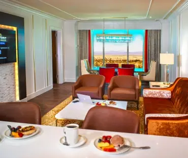 South Point suite living area with dining and seating