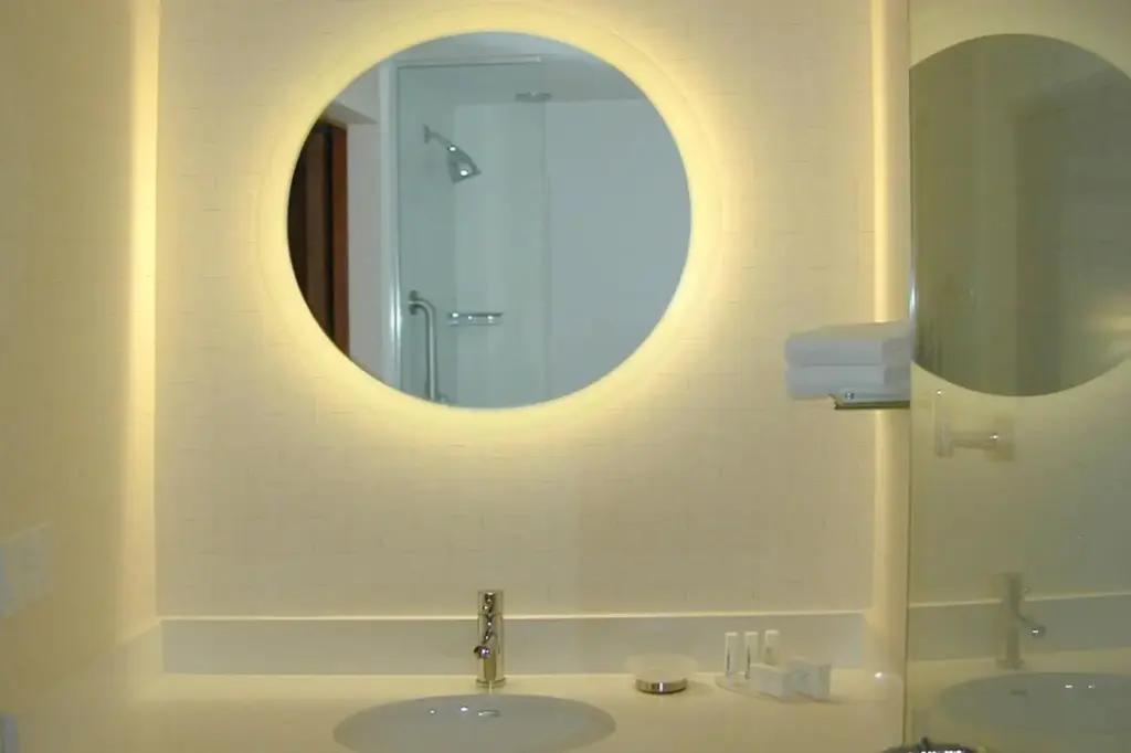 a bathroom with a sink and a mirror at SpringHill Suites by Marriott Las Vegas North Speedway in Las Vegas