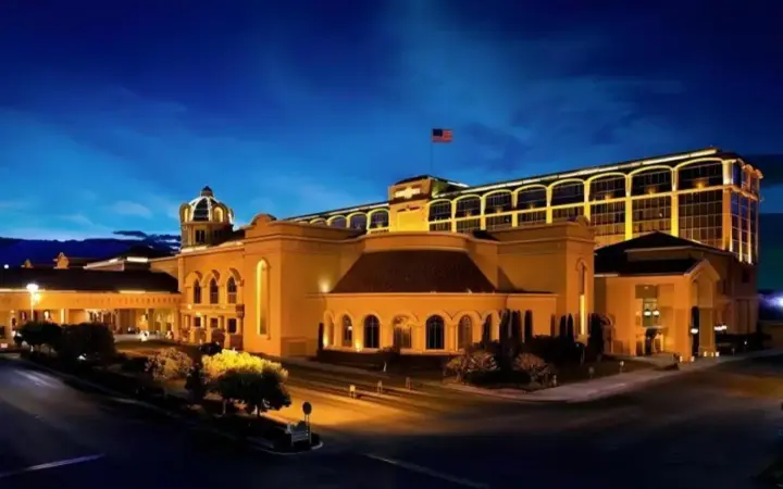 a large building with a flag on top of it at Suncoast Hotel and Casino in Las Vegas
