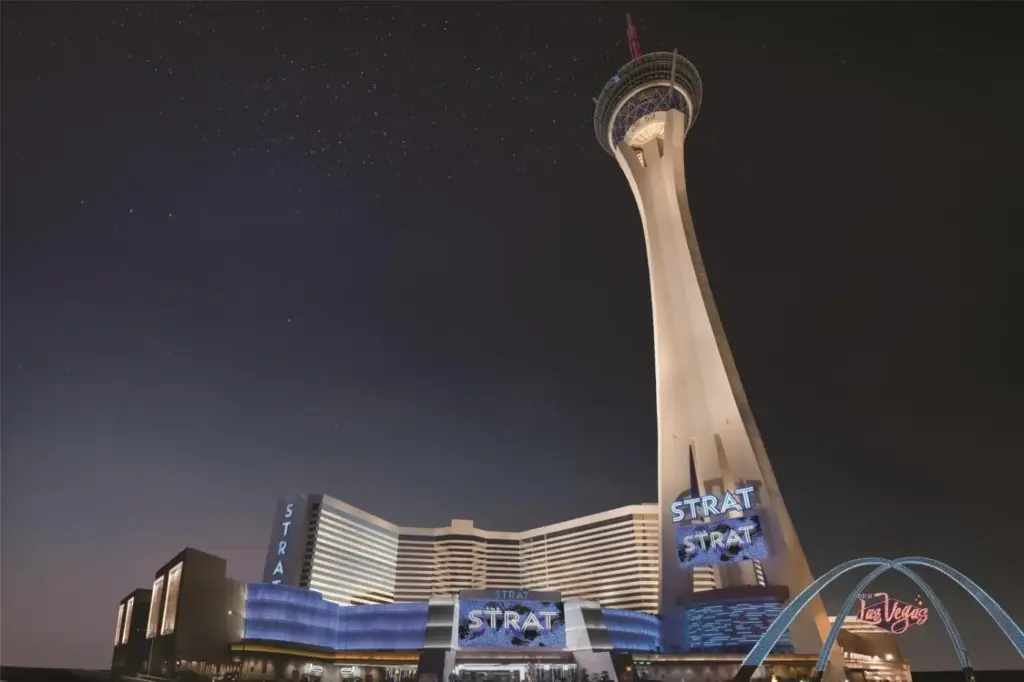 a view of a skyscraper with a tower at night at The STRAT Hotel, Casino & Tower in Las Vegas
