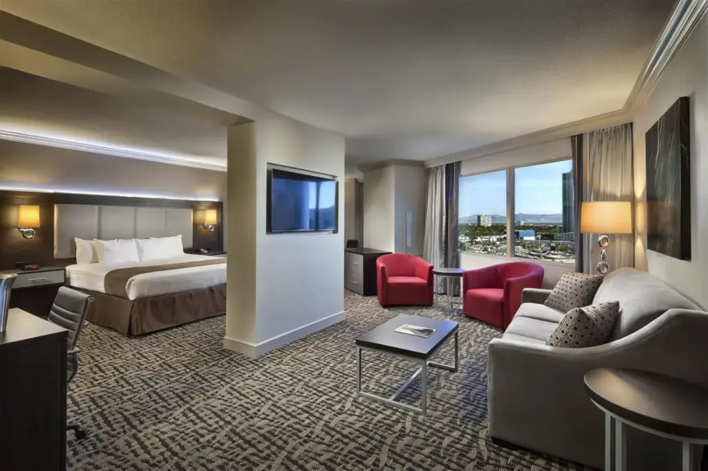 a hotel room with a bed and a tv at The STRAT Hotel, Casino & Tower in Las Vegas