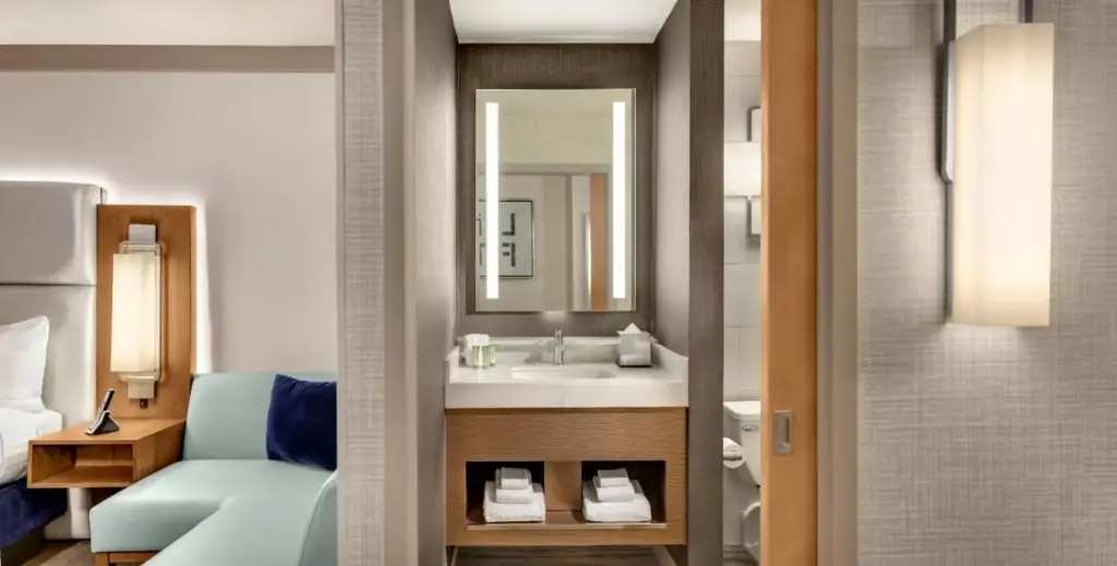 a bathroom with a sink and a mirror at The STRAT Hotel, Casino & Tower in Las Vegas