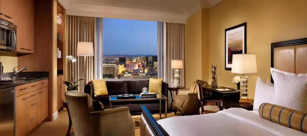 a hotel room with a bed and a view of a city at Trump International Hotel Las Vegas in Las Vegas